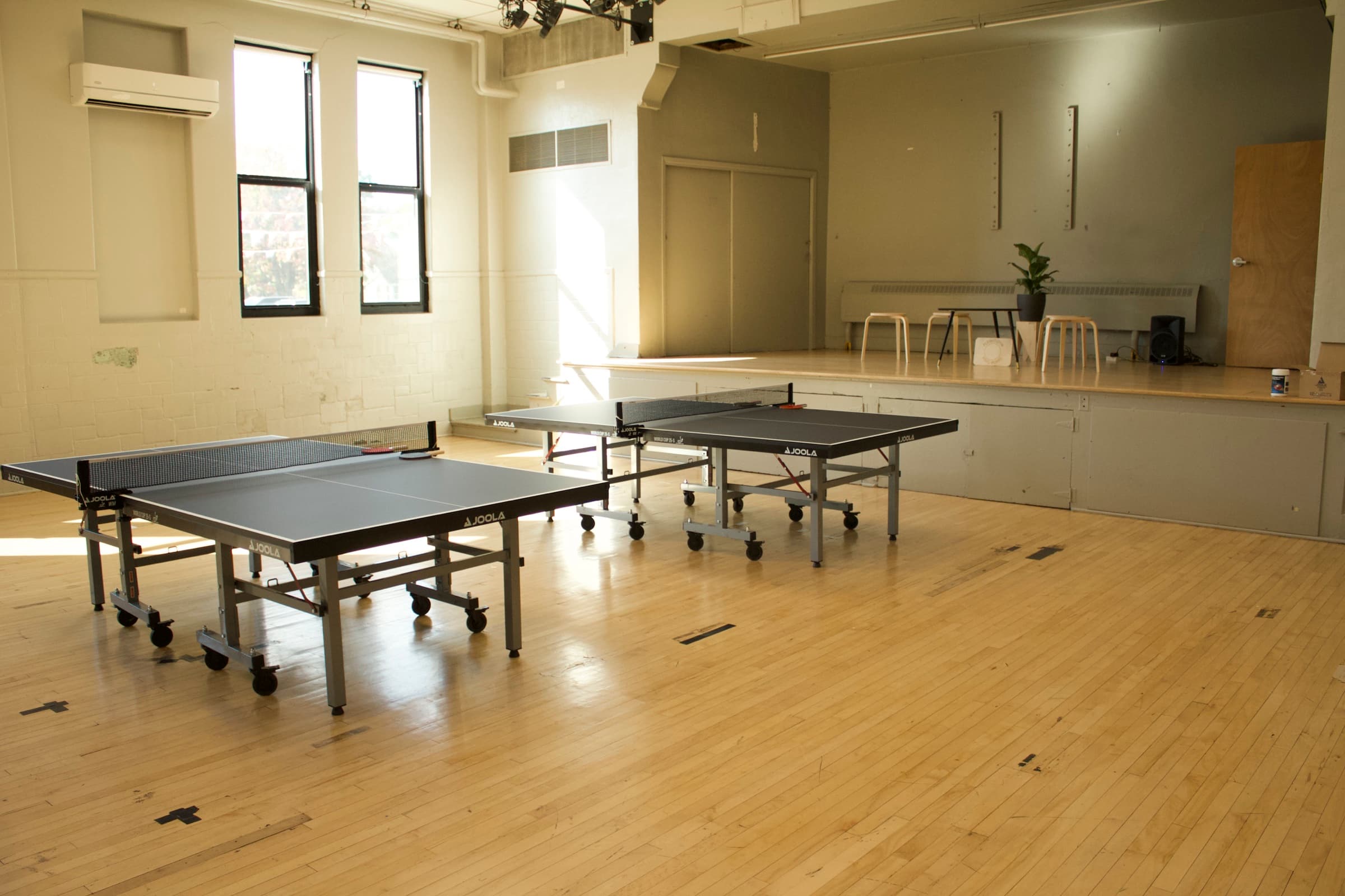Two table tennis tables set up in the Plymouth Ping Pong space