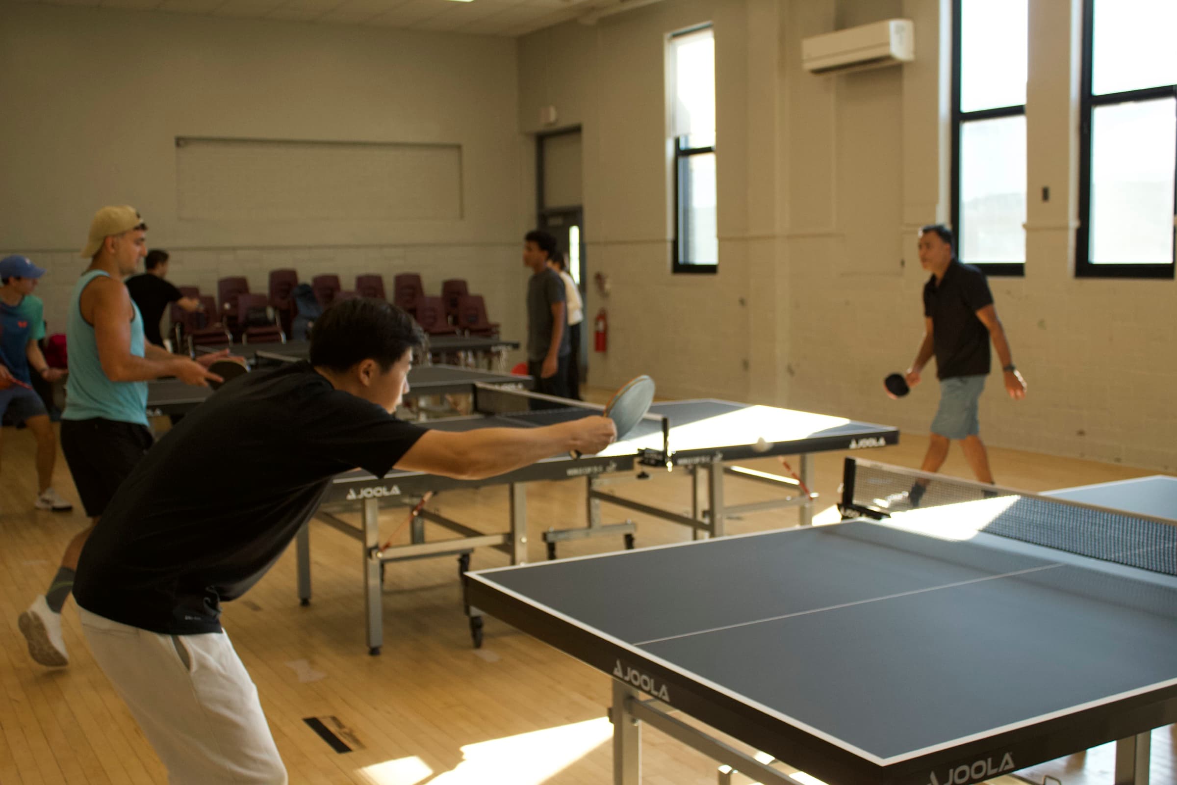 Table tennis players in action at Plymouth Ping Pong